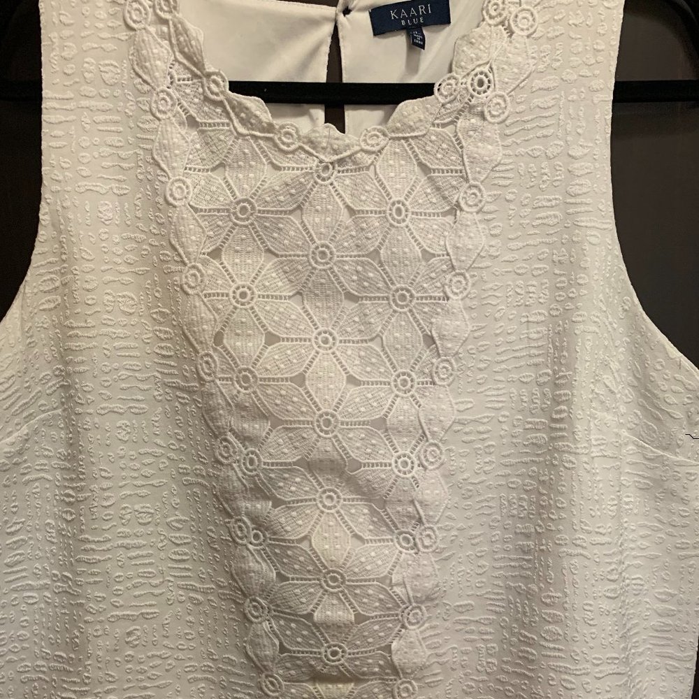 White sleeveless top
